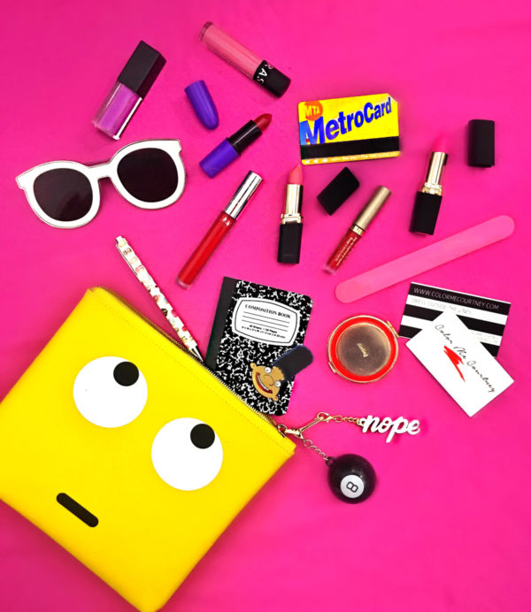Yellow clutch with accessories