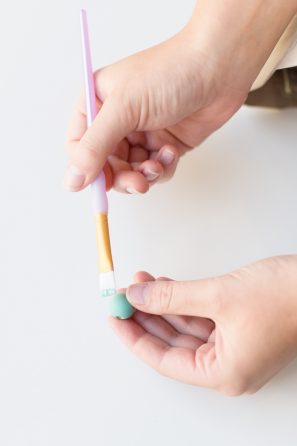Someone holding a paintbrush