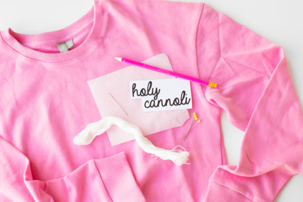 A pink crewneck and embroidery