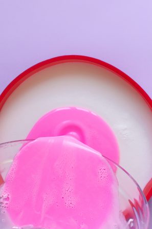 Someone pouring a pink substance