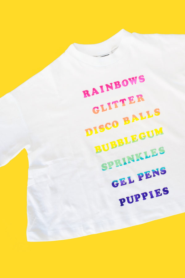 A white shirt with rainbow words