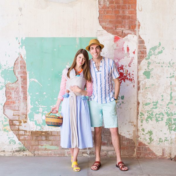 A man and a woman in front of a brick building