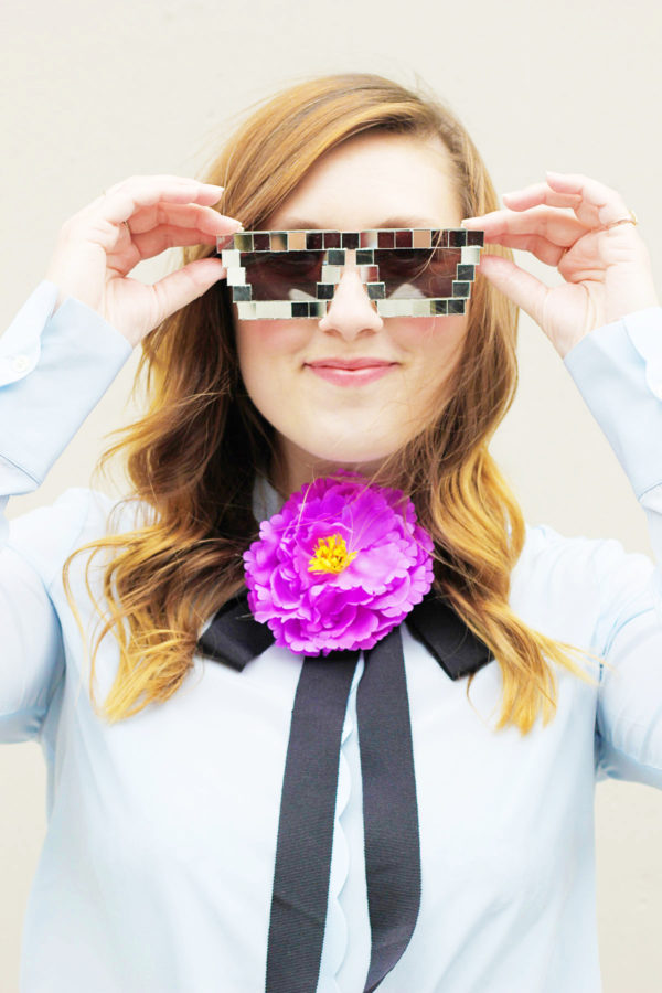 A woman wearing disco sunglasses