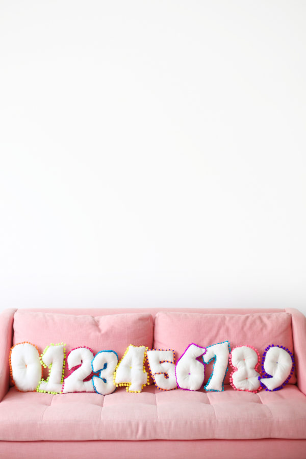 A sofa in a room with pillows