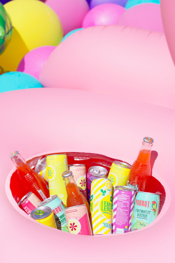 A red bowl with drinks in it