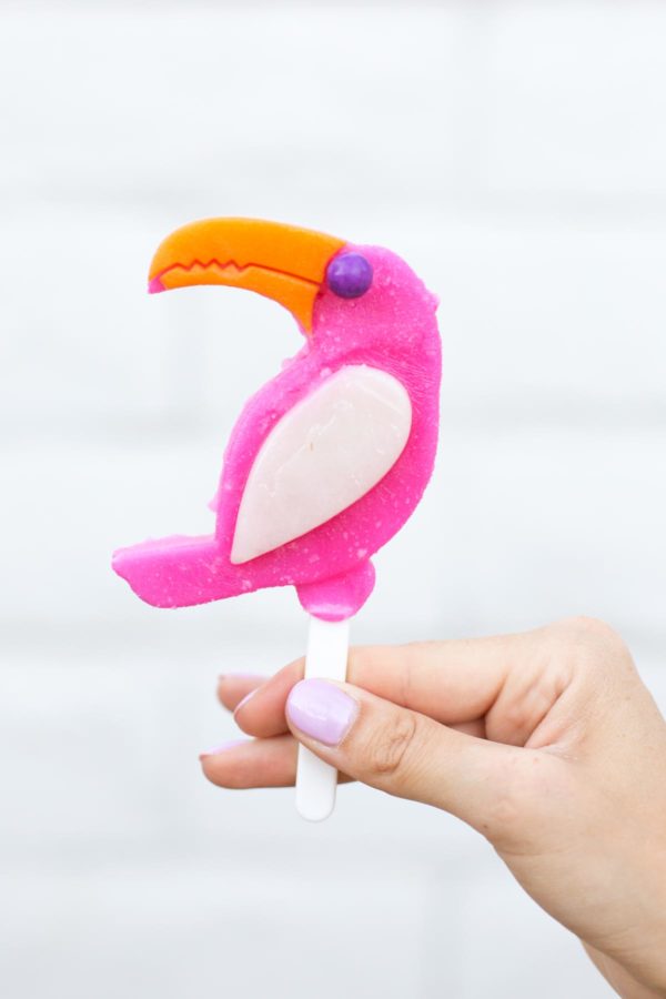 Someone holding a tropical popsicle