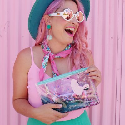 What's In My Clutch: Hot Pink Pineapples A girl holding an ocean clutch