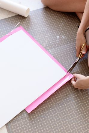 Someone cutting paper