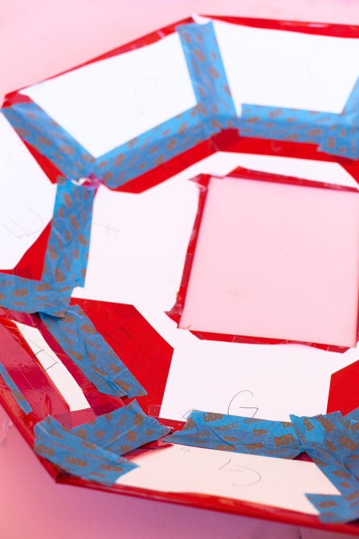 Red paper cut-outs and tape