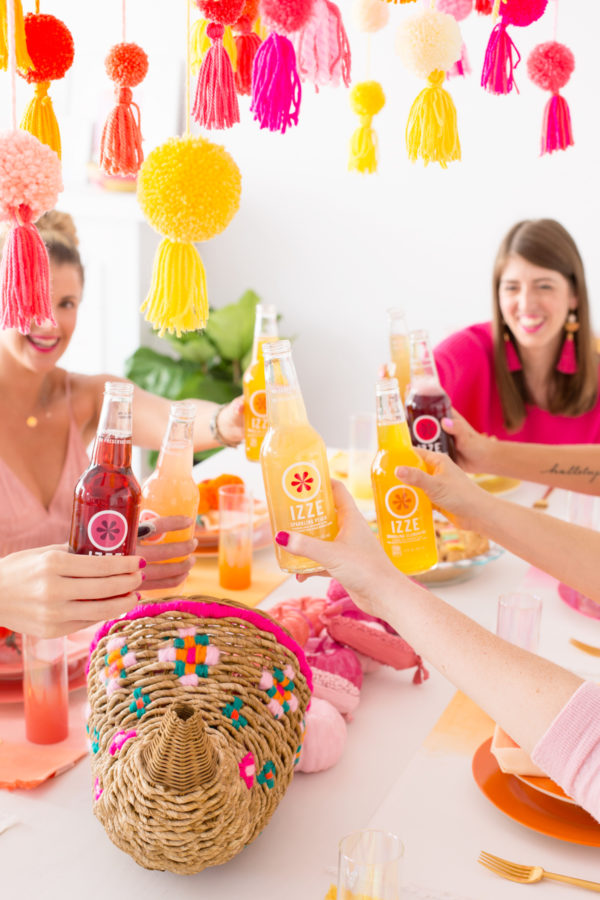 A group drinking izze drinks