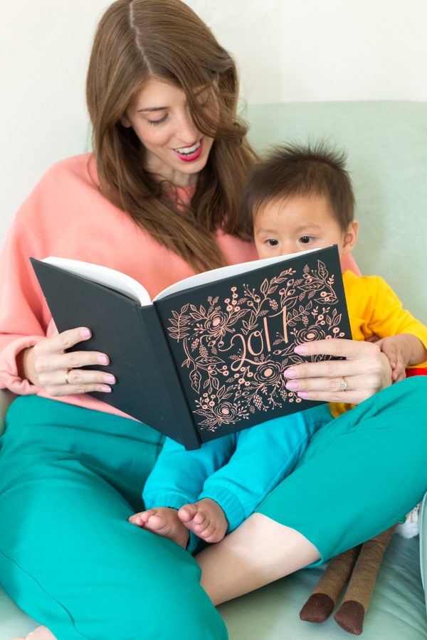 Two people reading a book