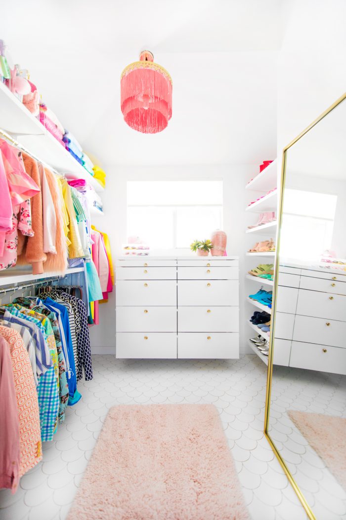 Closet with a mirror and rug