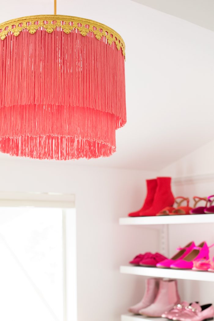 A close up of a pink chandelier