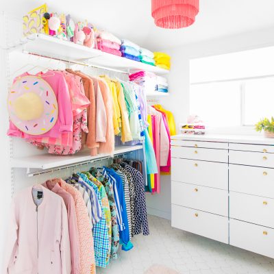Our Closet Laundry Room Reveal + Ideas Colorful clothes in a closet