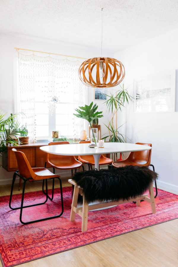 A dining room table in front of a window
