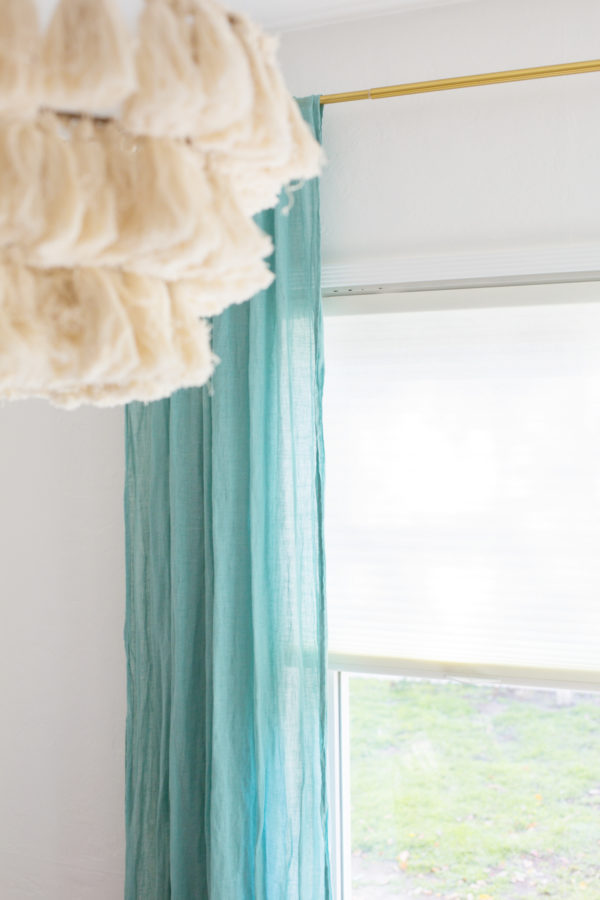 A blue curtain and a window