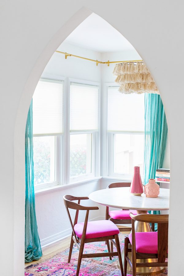 A dining room table in front of a window