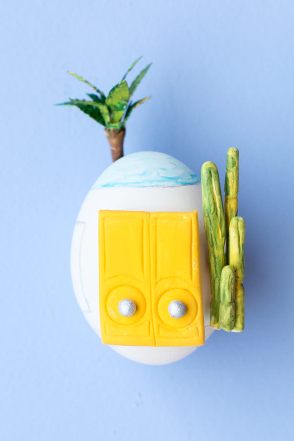 An egg with a yellow door on it