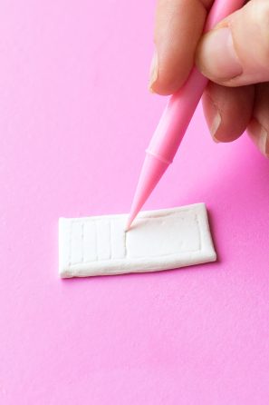 Someone sculpting clay