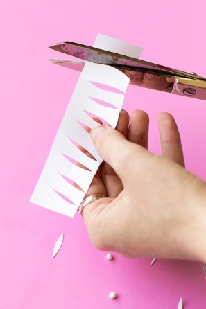 Someone cutting paper