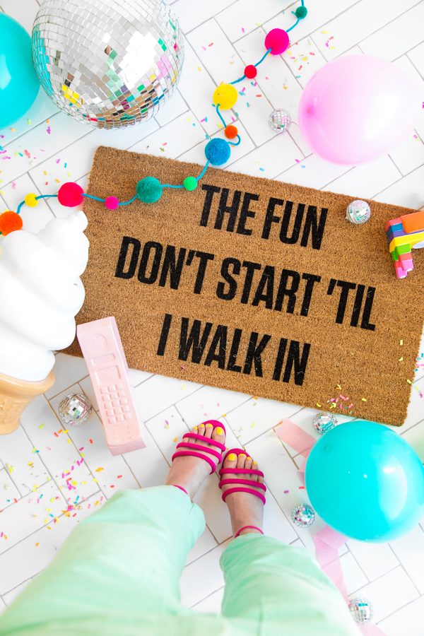 A welcome mat and balloons