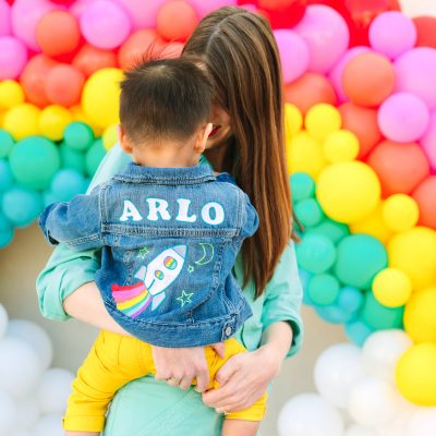Arlo's To Infinity and Beyond First Birthday Party Rainbow balloons and people