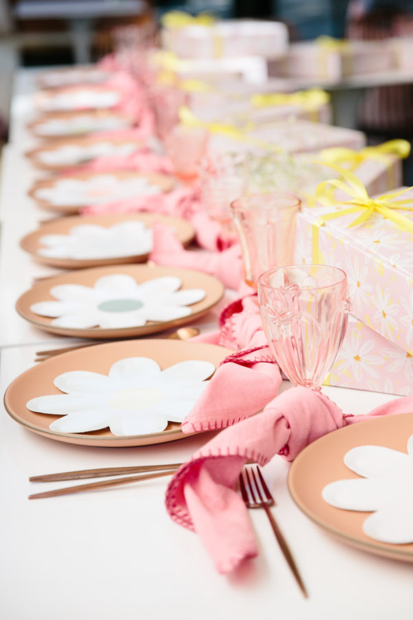 Plates set with glasses and utensils