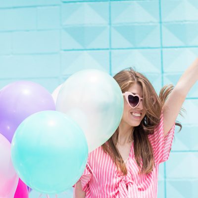 A woman wearing a pink shirt