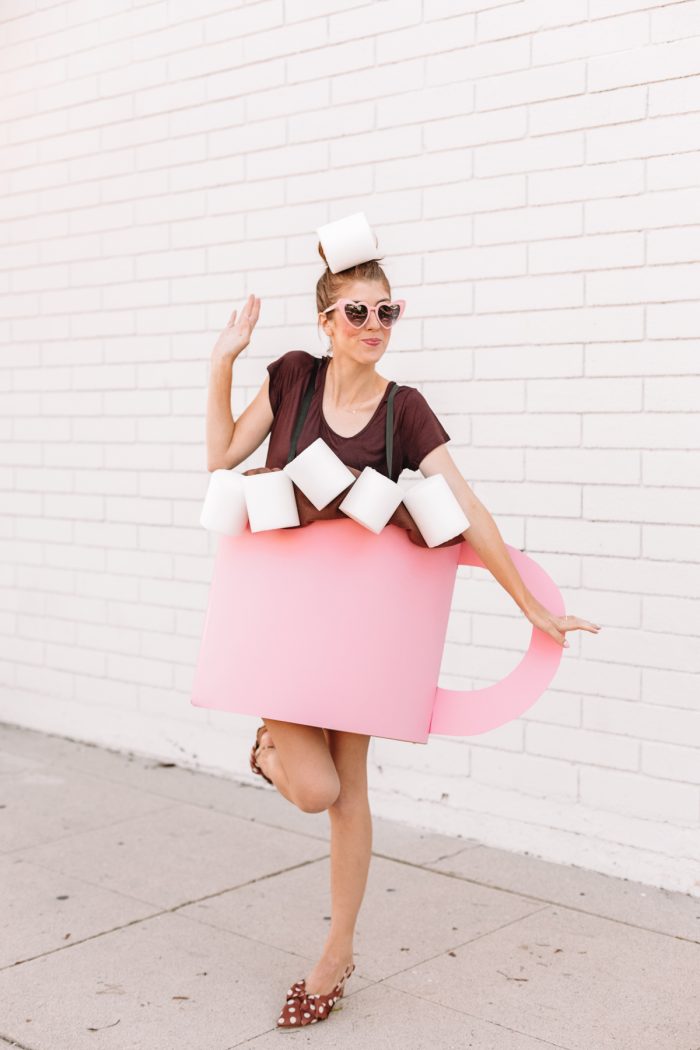 Hot Chocolate Christmas Costume A woman standing in front of a building dressed as hot chocolate