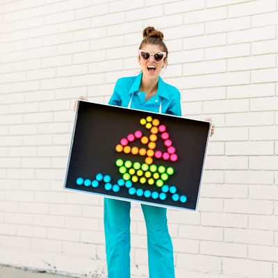 DIY Lite Brite Costume A person holding a sign