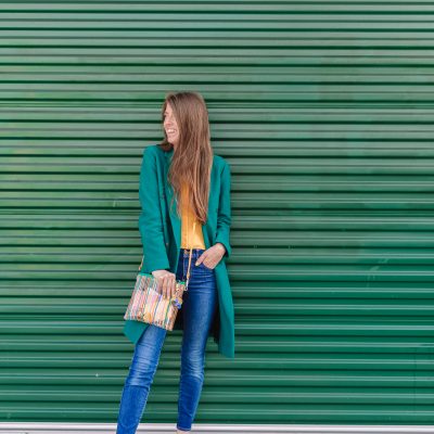 10 Things I Wish I Knew When I Started My Business A woman standing in front of a green wall