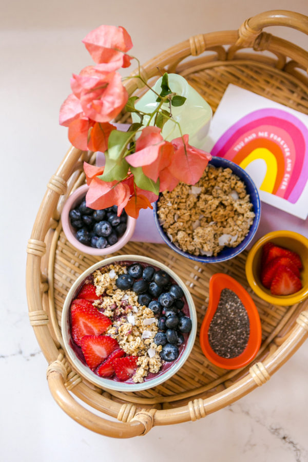 A bowl filled with different types of food on a table
