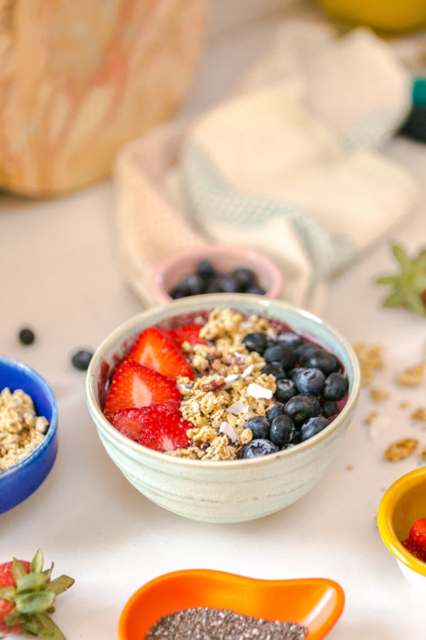 A fruit bowl of food on a table