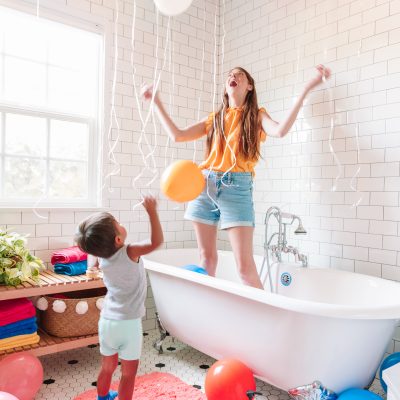 A woman standing in a bathtub