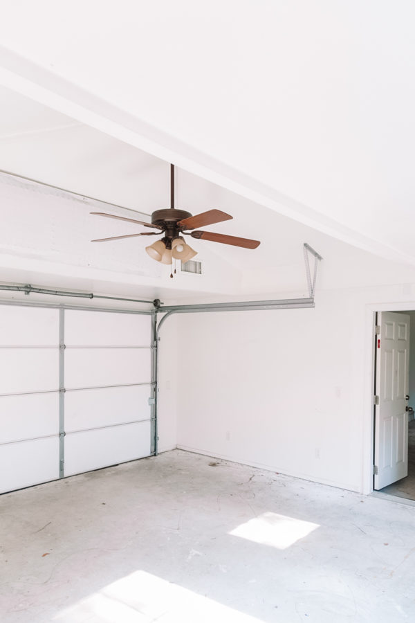 An empty room with a fan