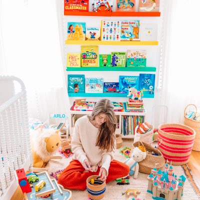 Our Parenting Philosophy On Kids' Toys (+ How To Get Family On Board) Someone sitting on the floor playing with toys