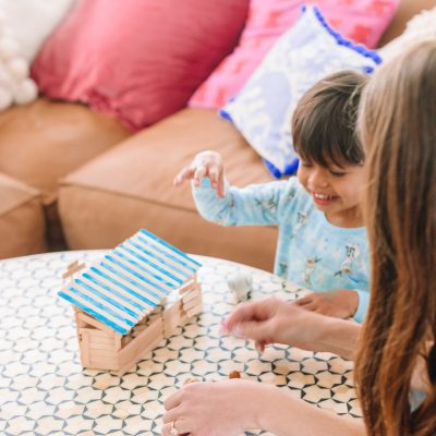 Toddler Camp: Ice Cream Day (Themed Activities and Crafts) A small child playing with popsicle sticks
