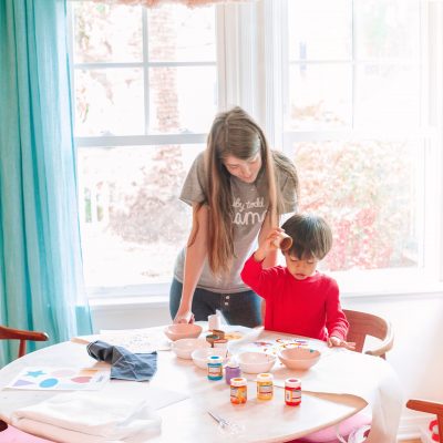 Toddler Camp: Easy Themed Activities for Toddlers at Home A woman sitting at a table in front of a window
