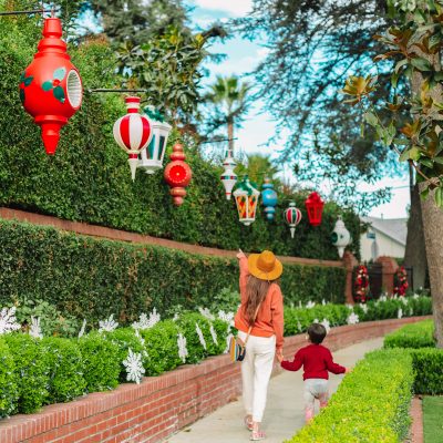 On Adding Magic & Adventure to the Every Day A mother and her son walking on the sidewalk