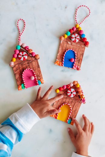 Three wooden gingerbread house ornaments