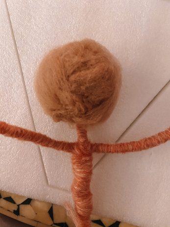 Yarn wrapped around wire in a ball shape