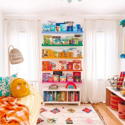 Transitioning From Nursery to Big Kid Room A bedroom with rainbow shelves