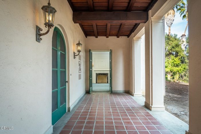 An outdoor walkway with tiles