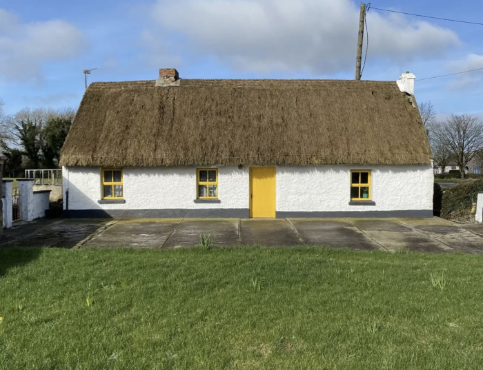 A building with a grassy field