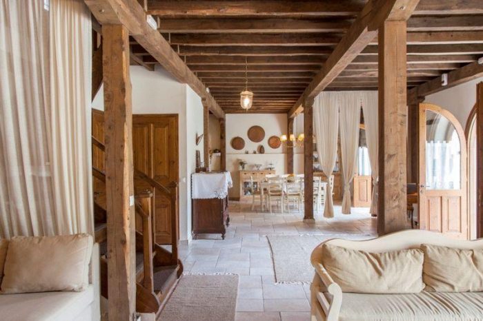 A room with chairs and a staircase