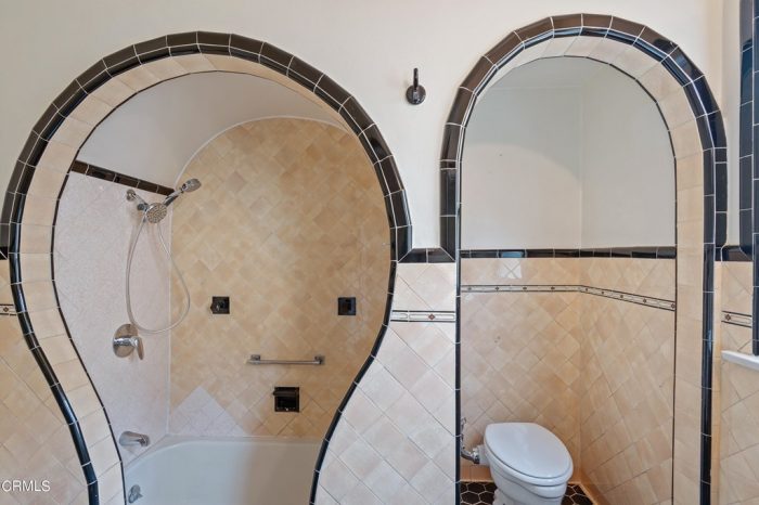 A bathroom with a toilet and shower