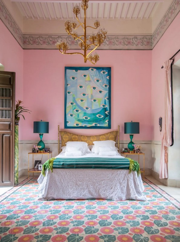 A pink bedroom with a bed