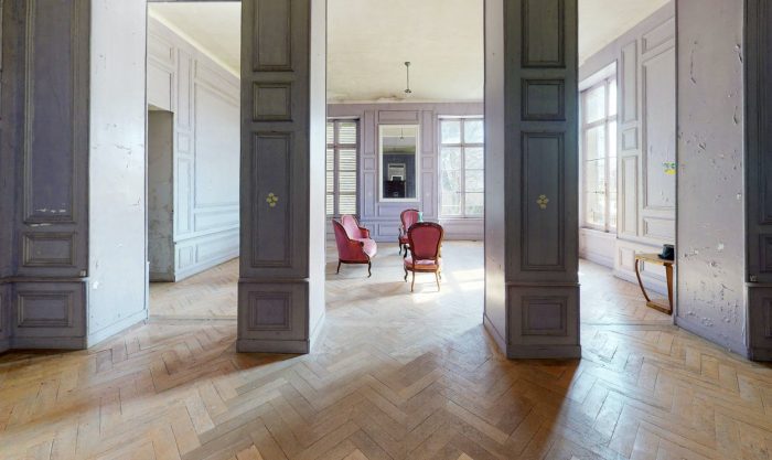 A purple living room with furniture