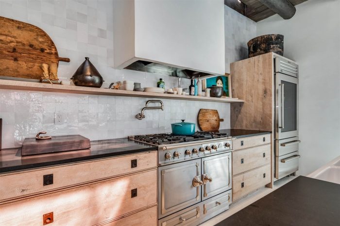 A stove top oven sitting inside of a kitchen