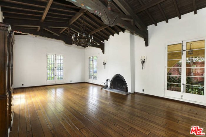 A room with a wood floor and wood ceilings